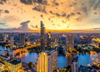 Panorama of Taksin Bridge over Chao Phraya River, Bangkok, Thailand at sunset.