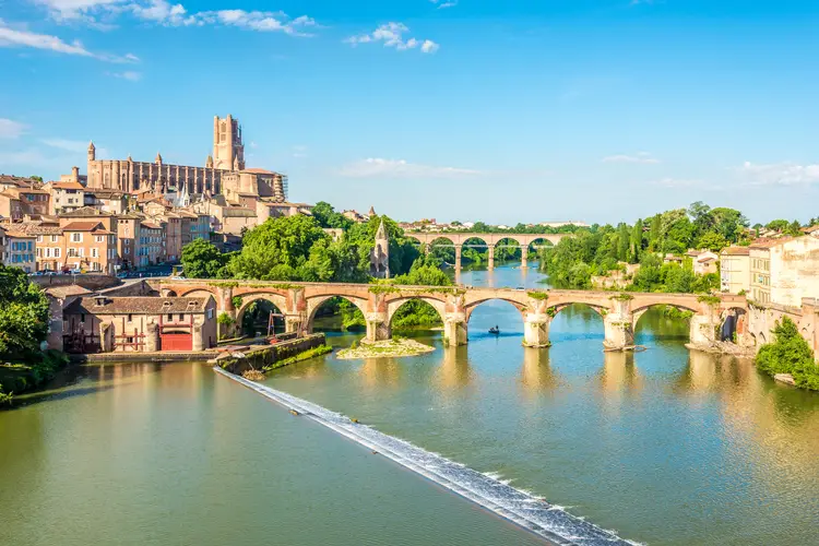 View at the Albi town with Old bridge over Tarn river, climate in France