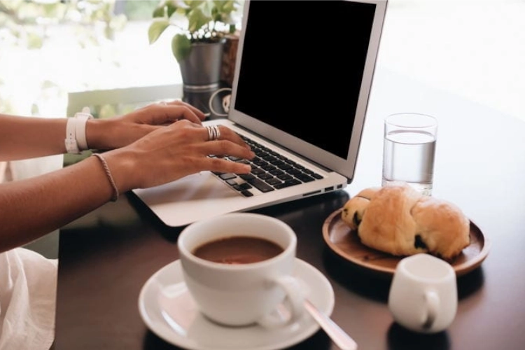 digital nomad working in medellin at breakfast time. Digital nomad is a great business opportunity abroad