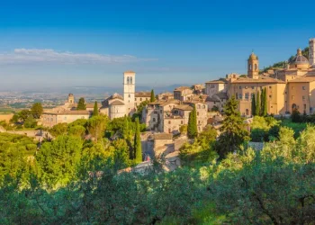 Historic town of Assisi at sunrise, Umbria, Italy. Elite Living