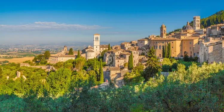 Historic town of Assisi at sunrise, Umbria, Italy. Elite Living