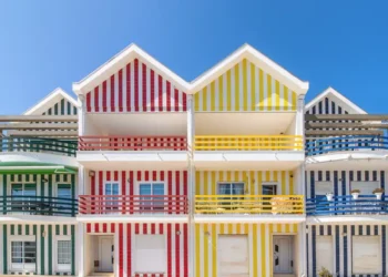 Street with colorful houses in Costa Nova, Aveiro, Portugal. Street with striped houses, Costa Nova, Aveiro, Portugal. Facades of colorful houses in Costa Nova, Aveiro Portugal