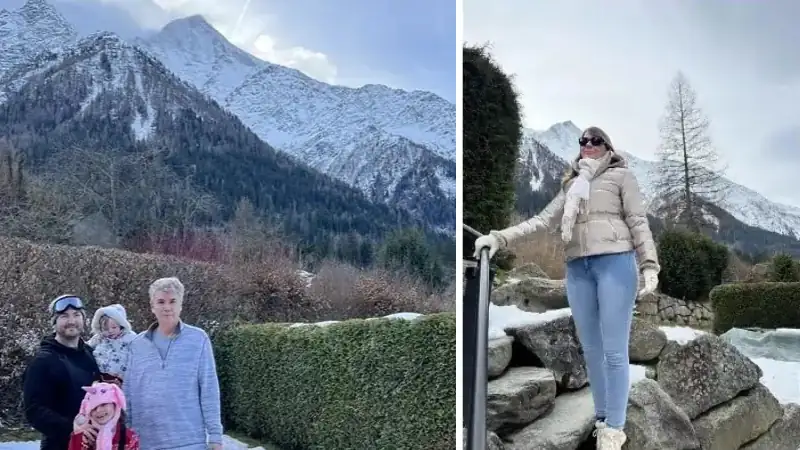 Kathleen Peddicord and Lief Simon pose with their family against a backdrop of snow-capped mountains during a winter reunion.