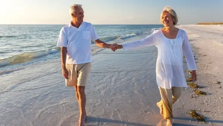 Retired couple walking in a beach. retire in panama