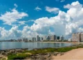 Tourist walking on Rambla (street) Claudio Wiliman towards a beach of Punta Del Este, Uruguay, January 28th 2019