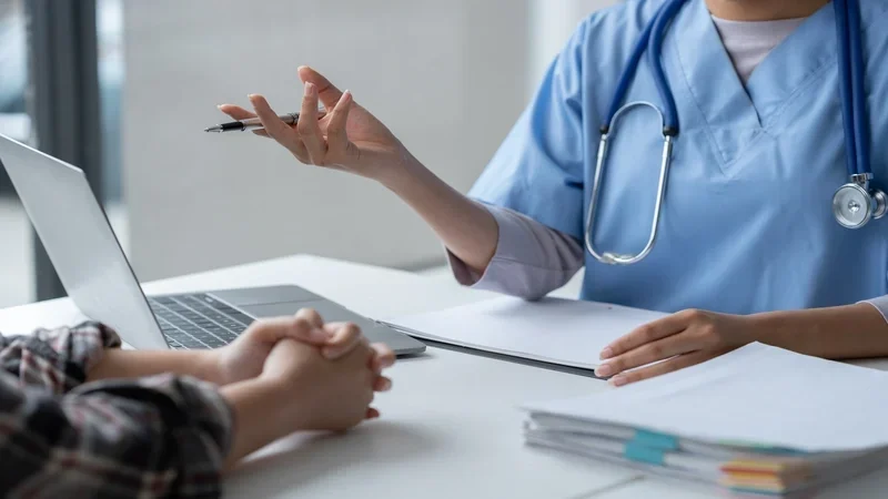 Female doctor using a stethoscope to examine a patient, asks for information,. health care in david