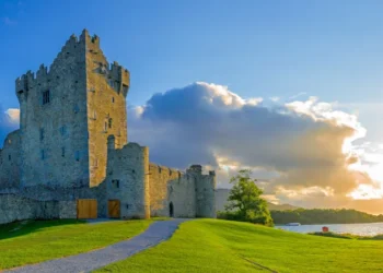 Idyllic landscape of Ross Castle in the Killarney National Park in Ireland. Travel by car through the Ring of Kerry.