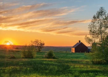 sunrise over farm Stock Photo