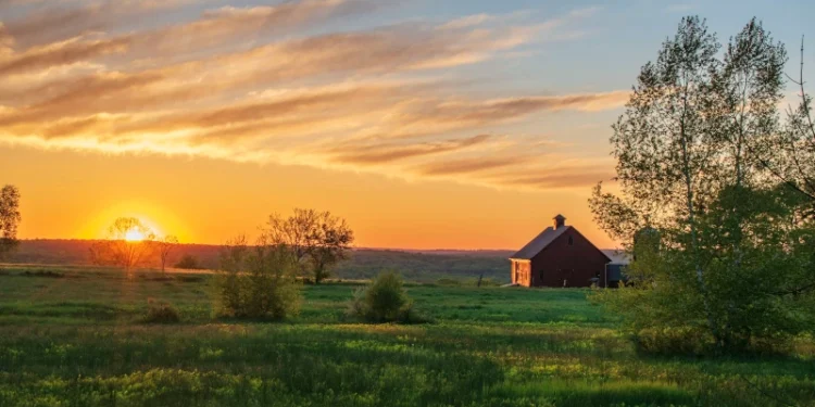 sunrise over farm Stock Photo