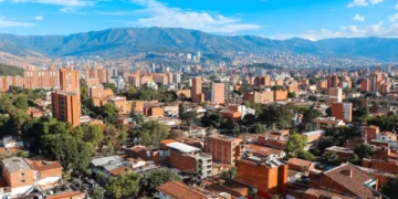 Panoramic view to Medellin, Laureles and El Poblado districts, Colombia, sunny day with clear blue sky