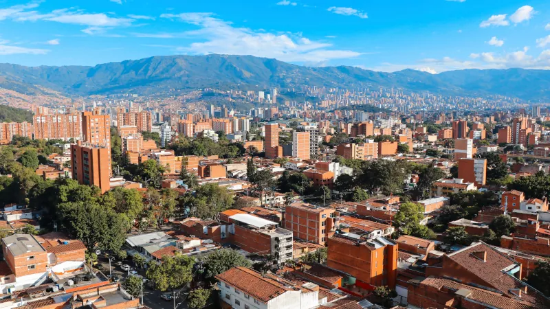 Panoramic view to Medellin, Laureles and El Poblado districts, Colombia, sunny day with clear blue sky