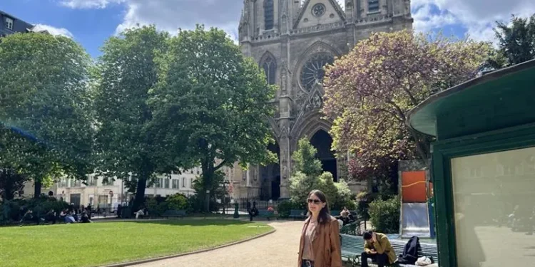 Kathleen Peddicord in Paris with Notre-Dame in the background