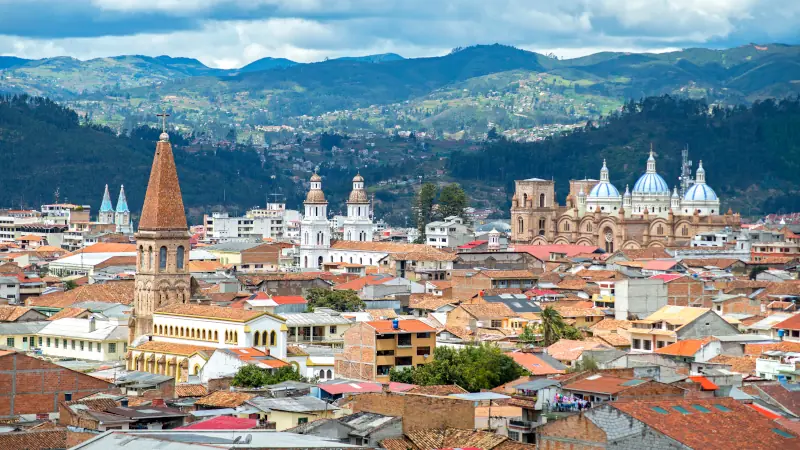 View of the city of Cuenca, Ecuador, with it's many churches and rooftops, on a cloudy day