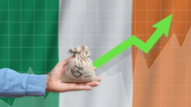 Hand holds a bag with money and an upward arrow
