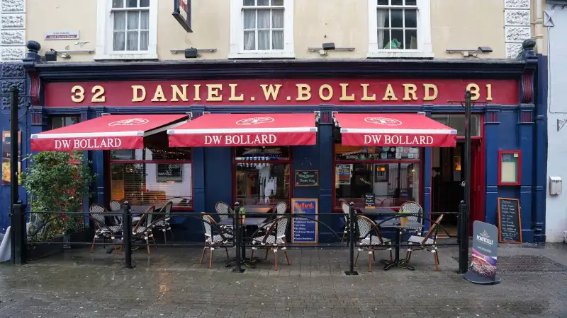 Kilkenny, Ireland, colorful restaurant with outdoor seating under awnings