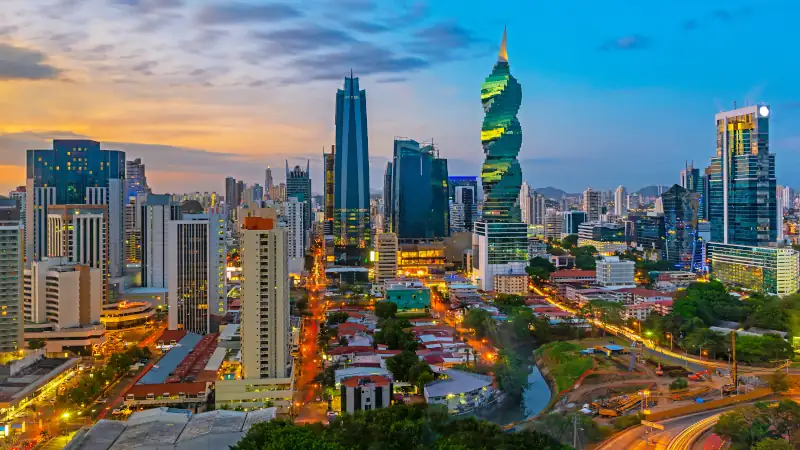 The colorful panoramic skyline of Panama City at sunset with high rise skyscrapers, Panama, Central America.