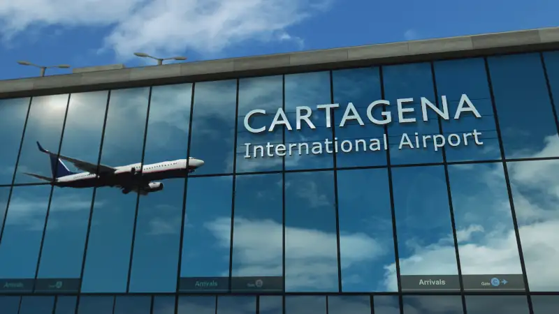 Airplane landing at Cartagena airport mirrored in terminal