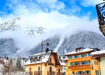 Chamonix town with snowy mountains on the background.