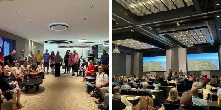 A group of attendees gathers and listens during the Live And Invest In Panama Conference