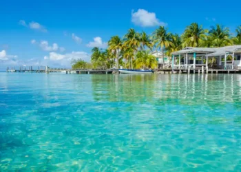 Small tropical island at Barrier Reef with paradise beach