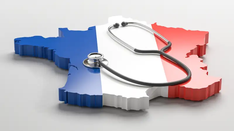 Healthcare in France concept: A stethoscope on a 3d map of France overlayed by the French flag.