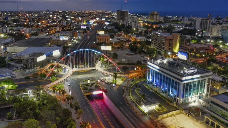 Landscape of a modern city surrounded by lights in the evening in the Dominican Republic