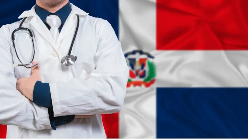 Male doctor with stethoscope on Dominican Republic flag.