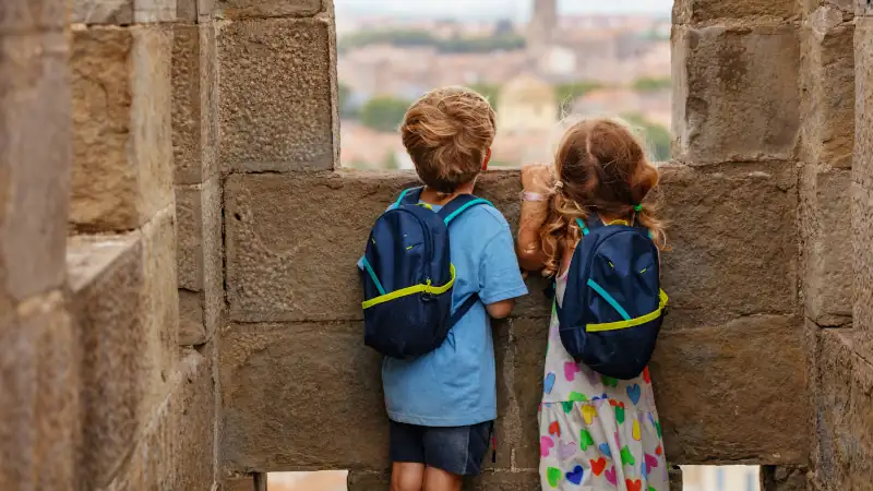 Young tourists wandering around at French fortress, Carcassonne