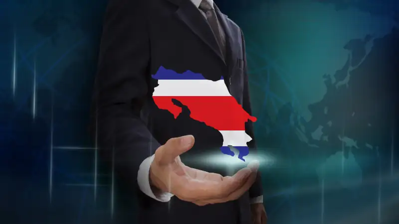 Businessman showing map of Costa Rica on globe background