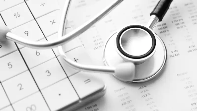 Stethoscope and calculator. Concept of health care costs or medical insurance