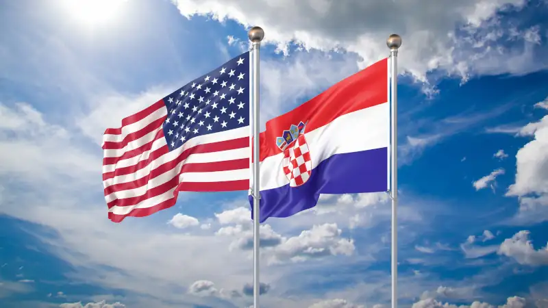 Waving flags of America and Croatia.