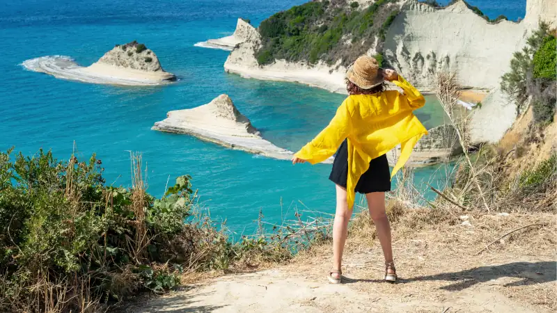 Woman Overlooking Canal d Amour Cliffs in Corfu Greece