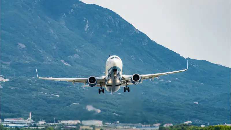 Sunny view of airplane taking off from airport of Tivat, Montenegro.