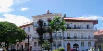 Historic colonial building with balconies and tropical plants in Casco Viejo, Panama City.