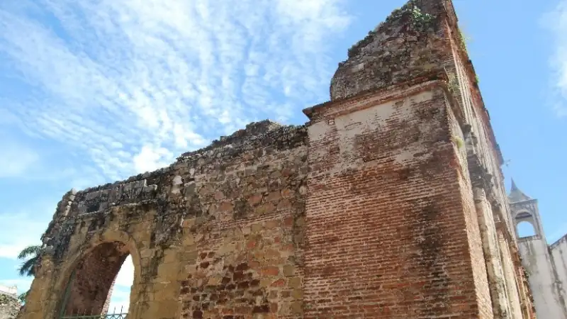 Historic ruins in Panama City with weathered brick and stone walls.