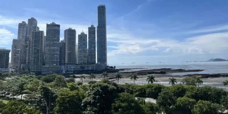 Panama City skyline overlooking the Pacific Ocean, with modern high-rise buildings along the waterfront.