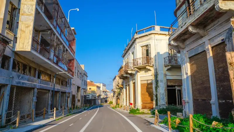 Street of abandoned resort quarter Varosha of city Famagusta, Northern Cyprus. Between 1970 and 1974, it was one of the most popular tourist destinations in the world.