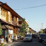 A street in Bali, Indonesia with cars and people