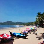 Boats and umbrellas on the beach in Goa