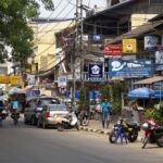 A busy street lined with shops in Laos