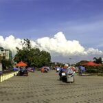 Venfor carts on riverfront sidewalk in Laos