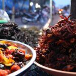 Spicy delicacies for sale at a market in Cambodia.