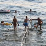 Locals swim at the beach on the Istrian coast.