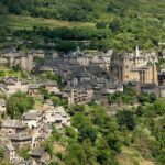 French Gothic buildings spread across the hills.