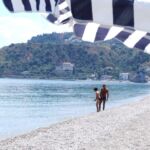 Swimmers on a quiet Italian beach.