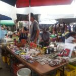 Belize market with local specialties for sale, including habanero sauce