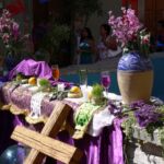 A temporary altar with offerings of wine and herbs in Mexico.