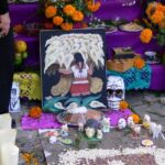 An offering to the dead including food and flowers, in Mexico.