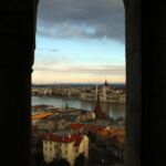 looking out a window onto budapest