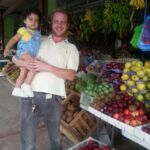 The author with his daughter on a trip to the market